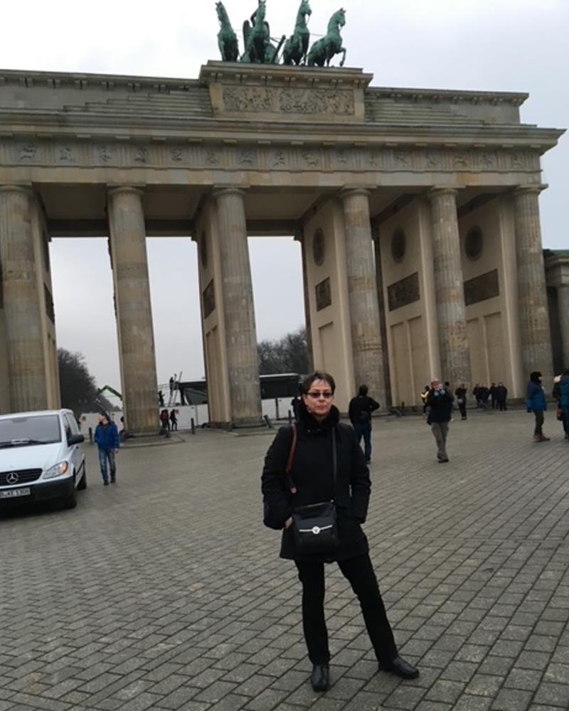 Busch standing in front of Brandenburg Gate in Berlin